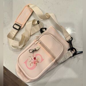 Tumbler Carrier with Strap and Zipper Pockets.